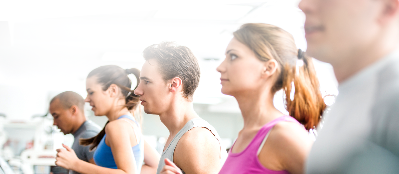 young men and women cardio training on treadmills at Cincinnati gym