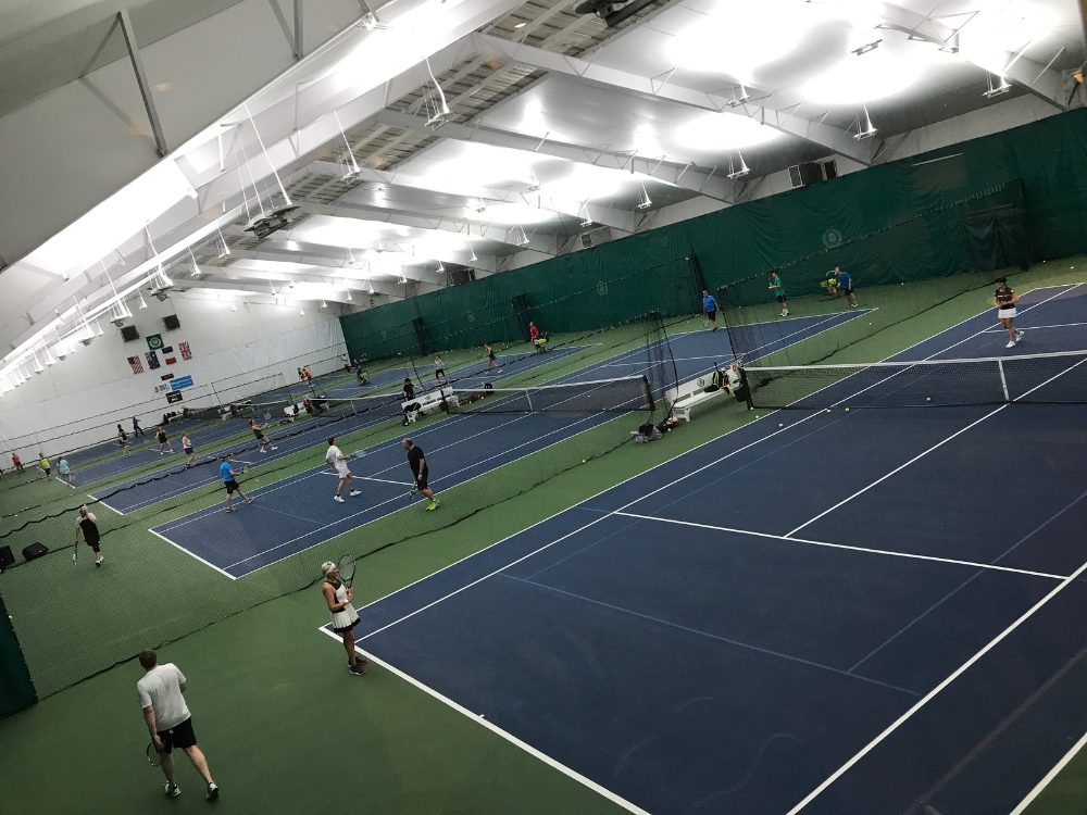 an aerial shot of adult tennis round robin clinics at the club at harpers point indoor courts in cincinnati