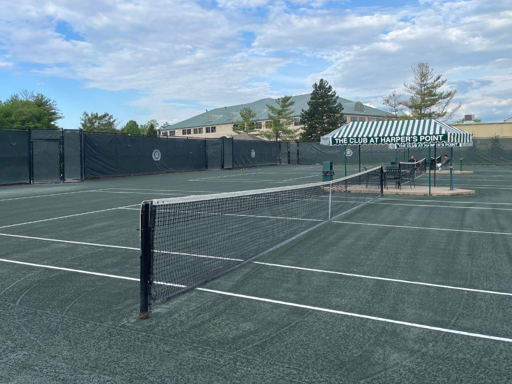 an outdoor tennis court at the club at harpers point in cincinnati