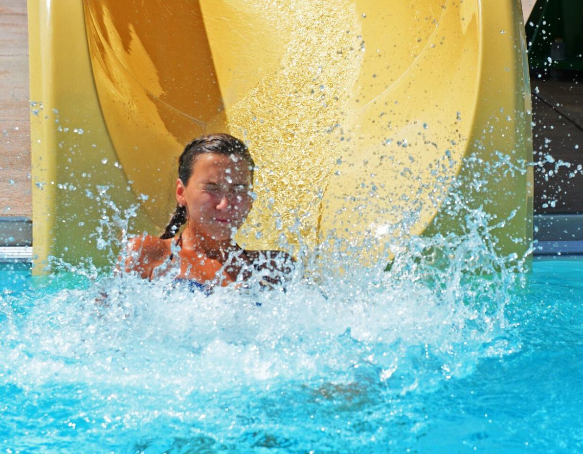 a club member slides into the outdoor pool at the club at harpers point in cincinnati