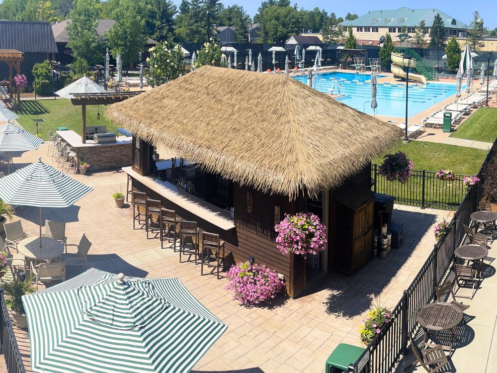 an outdoor cabana bar poolside at the club at harpers point in cincinnati